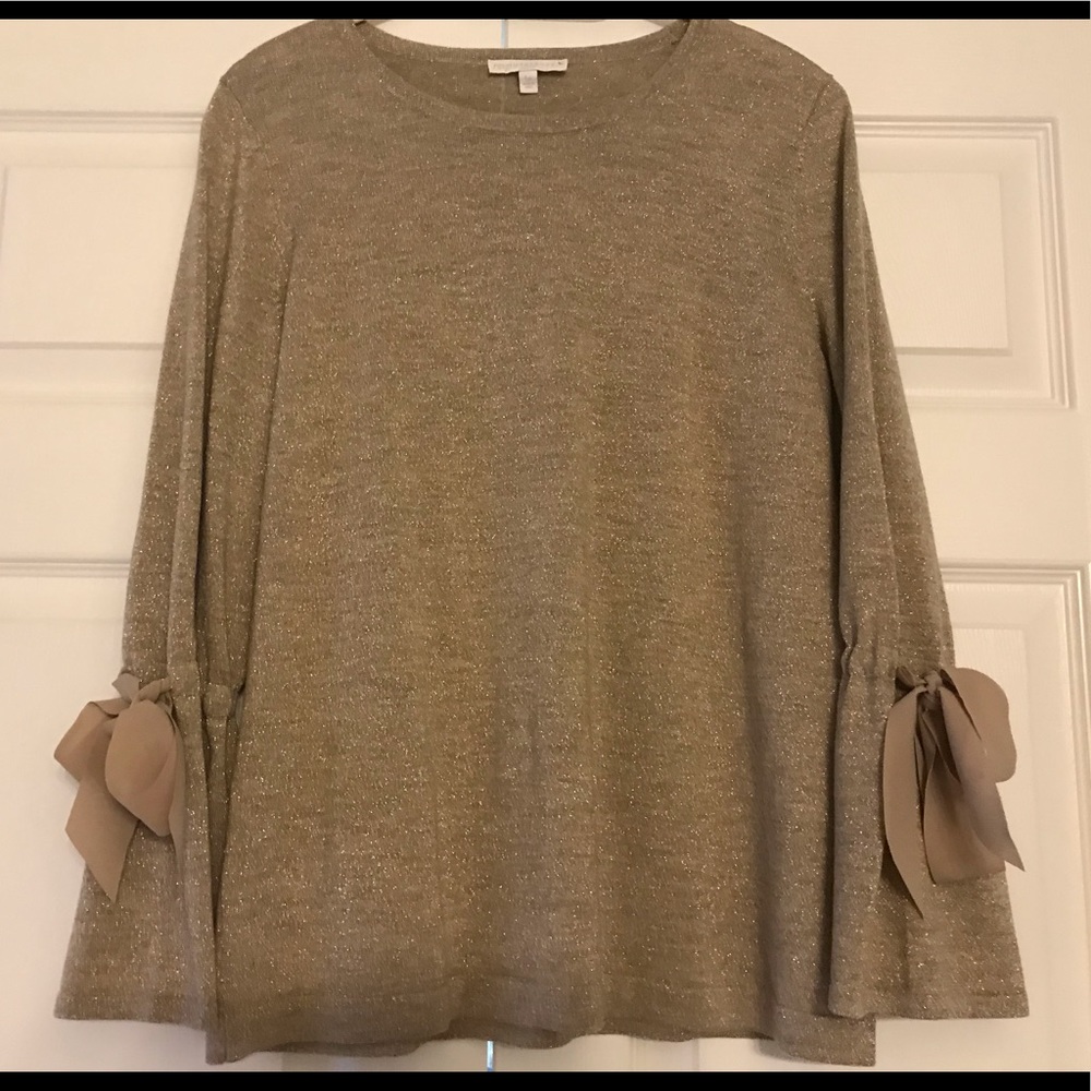 Gold sweater with bell sleeves and tie detail